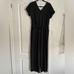 Sansara black jumpsuit.  Size small but fits like a medium